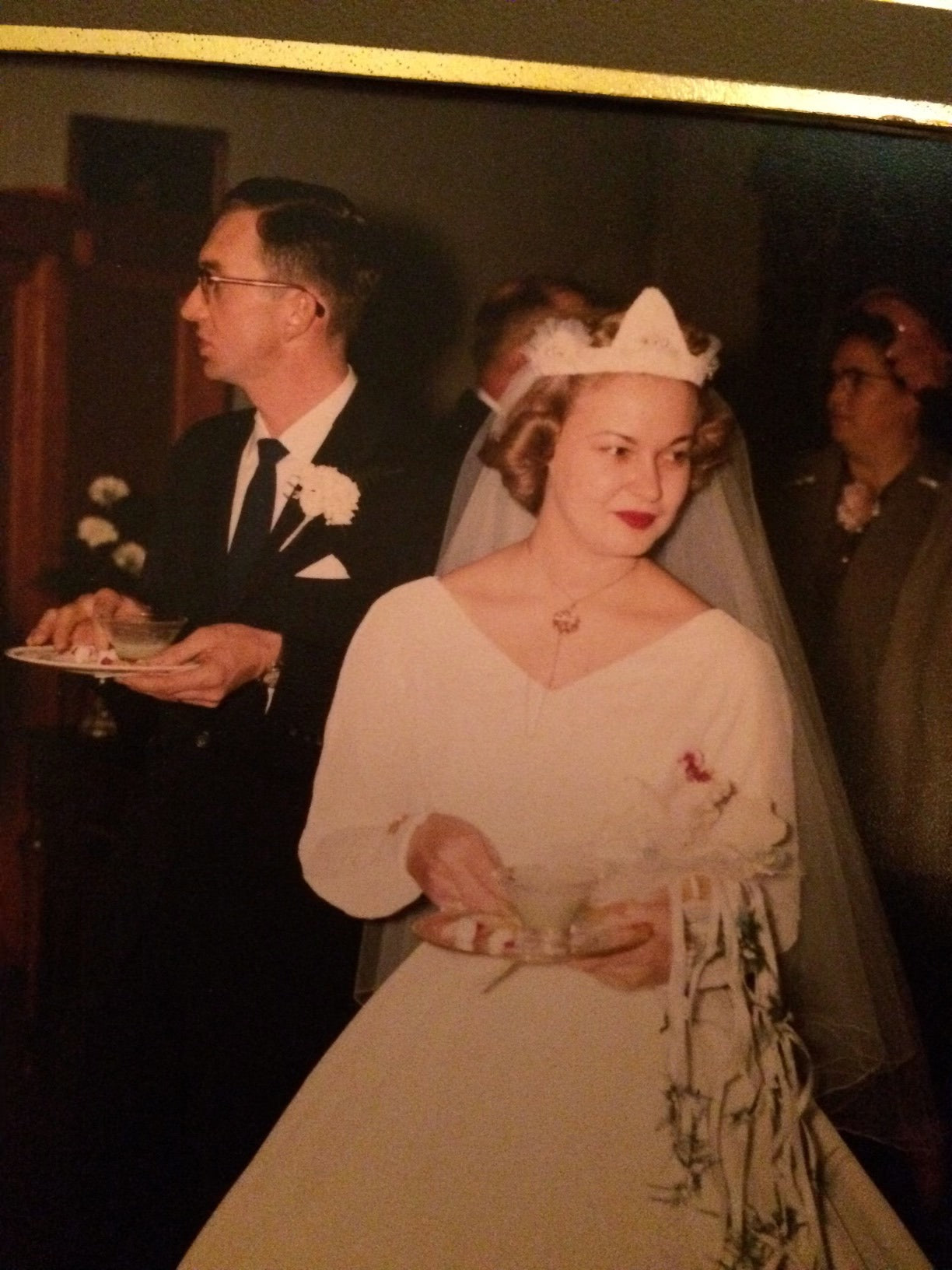 Mr and Mrs Hodgin enjoying a cup of tea at their wedding reception.